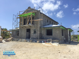 Looking at the front of the luxury custom home near Vista Del Mar, you can see that work has progressed on the roof and outer structure of the home.