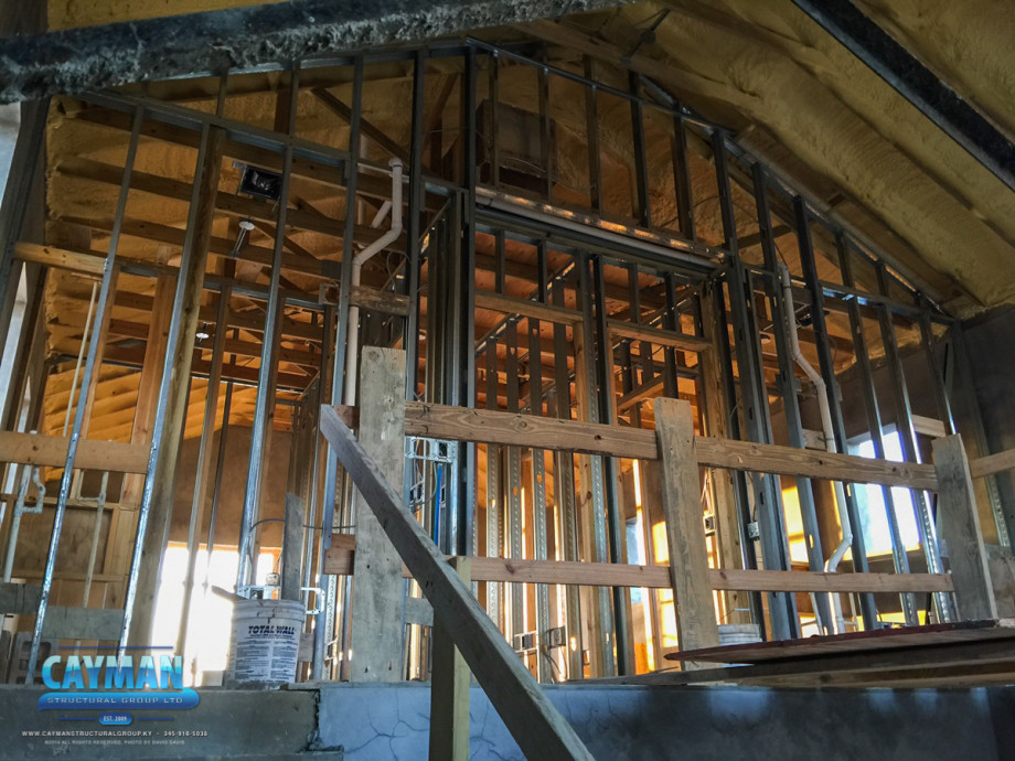 Spray foam insulation is installed by the general contractor, Cayman Structural Groups, to maintain a comfortable environment in the luxury custom home.
